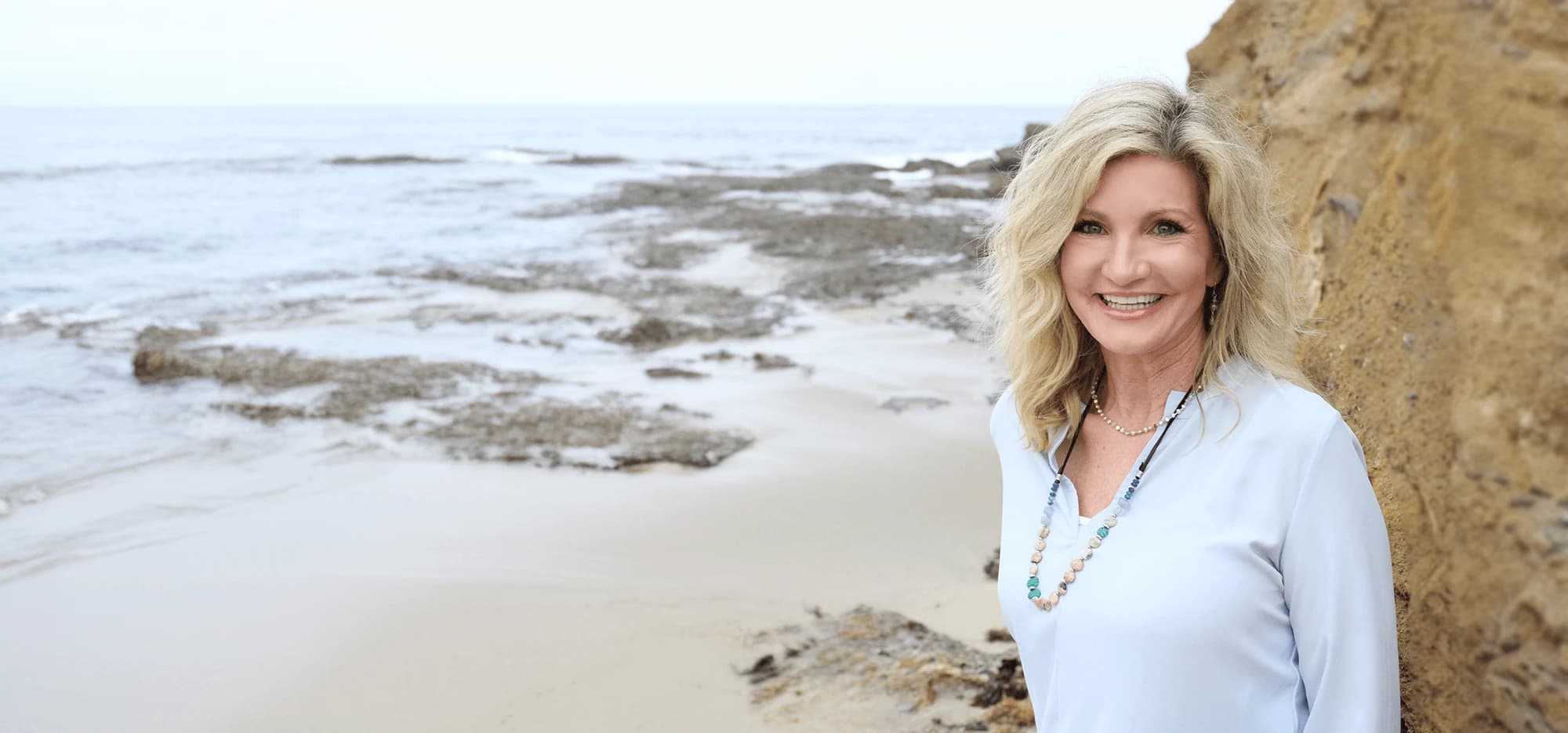 Dr. Lisa Gold by the sea